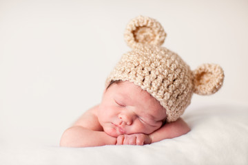 Newborn Baby in Knit Bear Hat, Sound Asleep