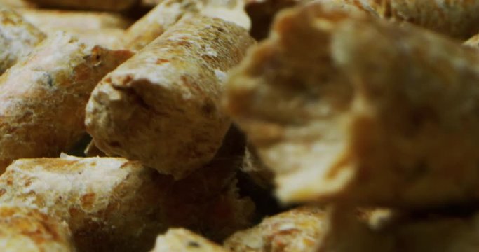 Super macro and slow motion framing of pellets or biofuels for stoves.