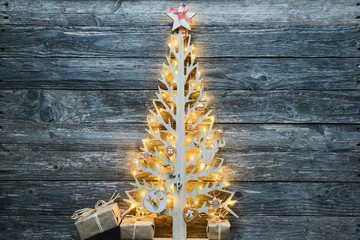 christmas wooden tree natural decoration ornament and copyspace on old wood board