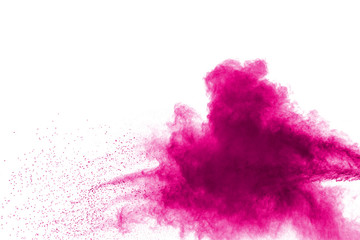 Abstract pink powder explosion on white background. Freeze motion of pink dust splattered.