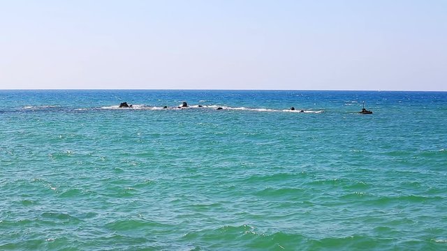 Small waves on Mediterranean sea near Andromeda's Rock in Jaffa city, Israel