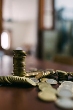 Shiny coins on table