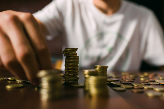 Crop guy counting coins