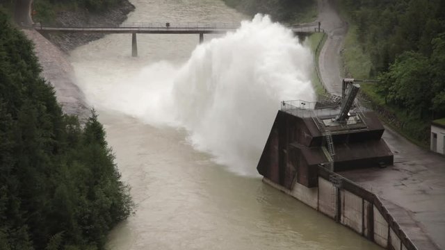 Klaus an der Pyhrnbahn, Austria - 05/06/2017: Klaus Dam (Klauser Stausee) flood overflow release valve opened during heavy rains on river Steyr