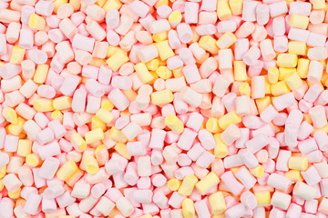 Marshmallow. Background of pink and yellow colorful mini marshmallows.