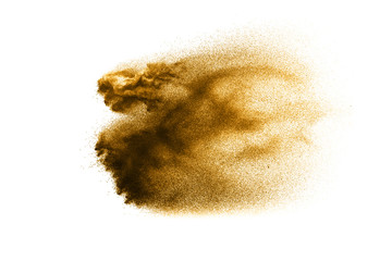 Dry river sand explosion. Golden colored sand splash against  white background.