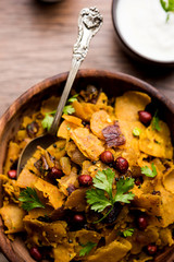 Homemade Kothu Parotta/ Paratha or Stir Fried Leftover Chapati Masala or  fodnichi poli in marathi, served in a bowl or plate with curd and hot tea. Selective focus