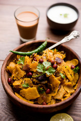 Homemade Kothu Parotta/ Paratha or Stir Fried Leftover Chapati Masala or  fodnichi poli in marathi, served in a bowl or plate with curd and hot tea. Selective focus