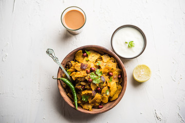 Homemade Kothu Parotta/ Paratha or Stir Fried Leftover Chapati Masala or  fodnichi poli in marathi, served in a bowl or plate with curd and hot tea. Selective focus