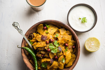 Homemade Kothu Parotta/ Paratha or Stir Fried Leftover Chapati Masala or  fodnichi poli in marathi, served in a bowl or plate with curd and hot tea. Selective focus