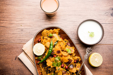 Homemade Kothu Parotta/ Paratha or Stir Fried Leftover Chapati Masala or  fodnichi poli in marathi, served in a bowl or plate with curd and hot tea. Selective focus