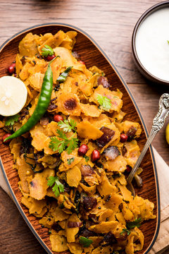 Homemade Kothu Parotta/ Paratha or Stir Fried Leftover Chapati Masala or  fodnichi poli in marathi, served in a bowl or plate with curd and hot tea. Selective focus