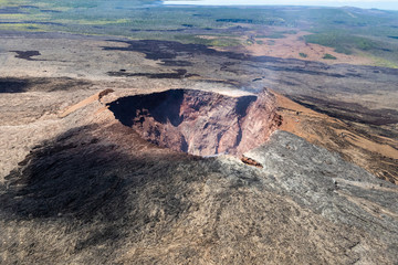 Fototapeta na wymiar aerial view of Puu Ooo Volcanic cone on the Big Island of Hawaii. Volcanic gas can be seen escaping from the crater. 