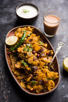 Homemade Kothu Parotta/ Paratha or Stir Fried Leftover Chapati Masala or  fodnichi poli in marathi, served in a bowl or plate with curd and hot tea. Selective focus