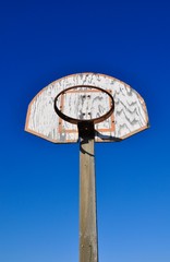 Basketball ring and board in blue sky