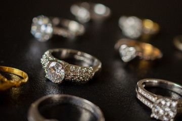 Jewelry diamond rings set on black background close up
