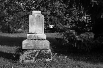 black and white photo of an old tombstone on the cemetery in Ostrava - Hrabova, Czech Republic