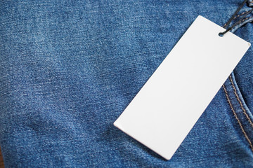 Blue jeans with blank white price label tag