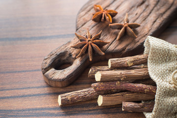 licorice root and anise on the table - Glycyrrhiza glabra