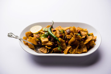 Homemade Kothu Parotta/ Paratha or Stir Fried Leftover Chapati Masala or  fodnichi poli in marathi, served in a bowl or plate with curd and hot tea. Selective focus