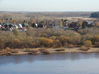 Autumn sunny day in a small town by the river
