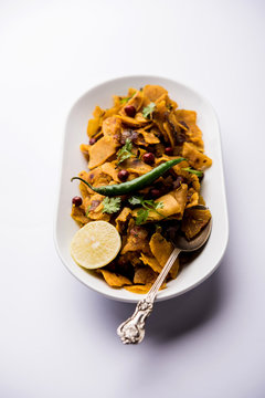 Homemade Kothu Parotta/ Paratha or Stir Fried Leftover Chapati Masala or  fodnichi poli in marathi, served in a bowl or plate with curd and hot tea. Selective focus