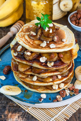 Chocolate-filled pancakes with caramelised bananas, honey and hazelnuts