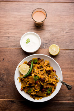Homemade Kothu Parotta/ Paratha or Stir Fried Leftover Chapati Masala or  fodnichi poli in marathi, served in a bowl or plate with curd and hot tea. Selective focus