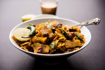 Homemade Kothu Parotta/ Paratha or Stir Fried Leftover Chapati Masala or  fodnichi poli in marathi, served in a bowl or plate with curd and hot tea. Selective focus