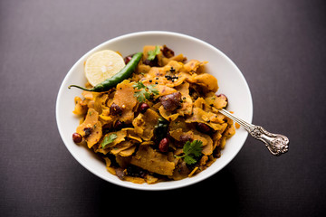 Homemade Kothu Parotta/ Paratha or Stir Fried Leftover Chapati Masala or  fodnichi poli in marathi, served in a bowl or plate with curd and hot tea. Selective focus