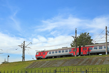 Commuter train arrives at the railway bridge of Novosibirsk