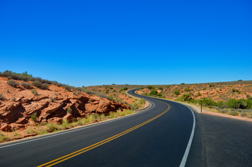 Fototapeta na wymiar Empty road and curves in Arches national park