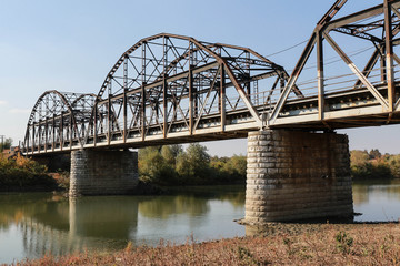 Combined road and railway bridge across the river