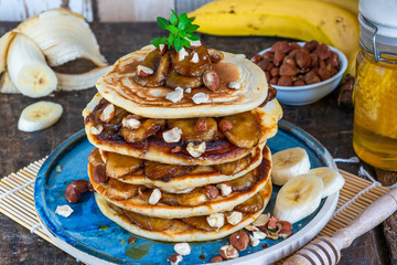 Chocolate-filled pancakes with caramelised bananas, honey and hazelnuts