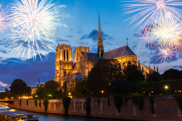 Notre Dame cathedral illuminated at blue night with fireworks, Paris, France