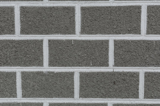 Concrete wall texture background with brick pattern