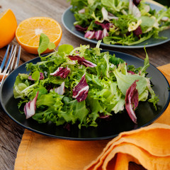 Healthy food. Fresh green salad with spinach,arugula,romaine and lettuce