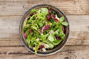 Healthy food. Fresh green salad with spinach,arugula,romaine and lettuce, copy space