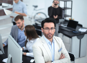 confident businessman on the background of the office