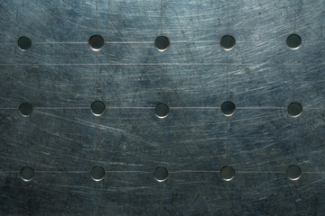 Old steel plate with holes