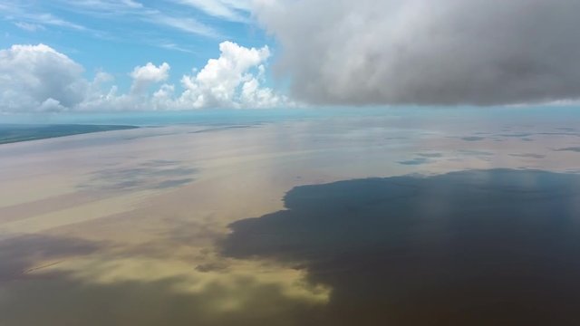 Amazing aerial landscape Mana river estuary drone view  along clouds. Guiana
