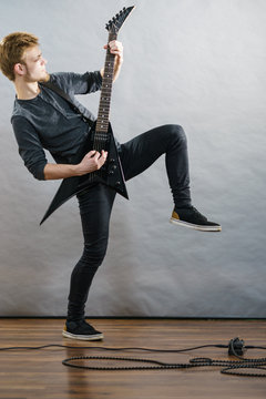 Man playing on electric guitar