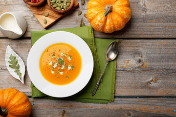 Vegetarian pumpkin cream soup. Autumnal pumpkin soup.