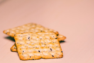 Full-grain cereal biscuits on light background and space for text.