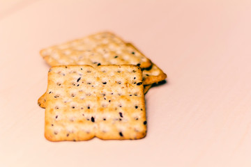 Full-grain cereal biscuits on light background and space for text.