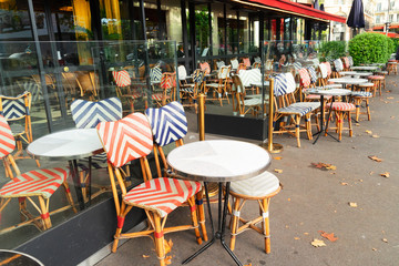 view of romantic Parisian street with outdoor cafe, Paris, France