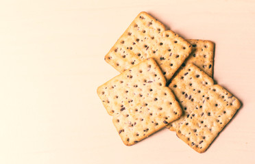 Full-grain cereal biscuits on light background and space for text.