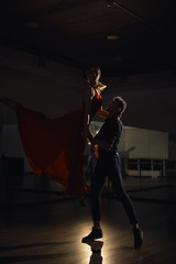 Fototapeta premium Passion dance couple, woman jumping