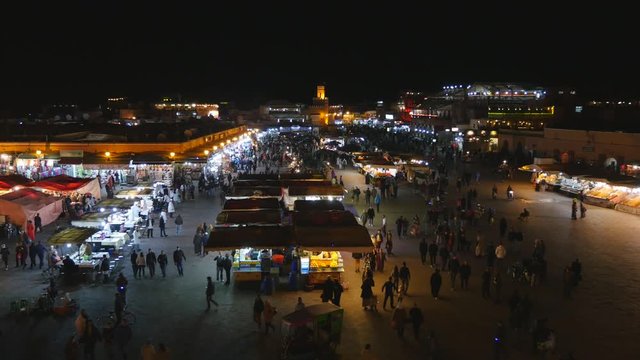People during night life Jemaa el-Fnaa square and market place in Marrakesh's medina quarter. Morroco