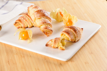 Small croissant with physalis fruits